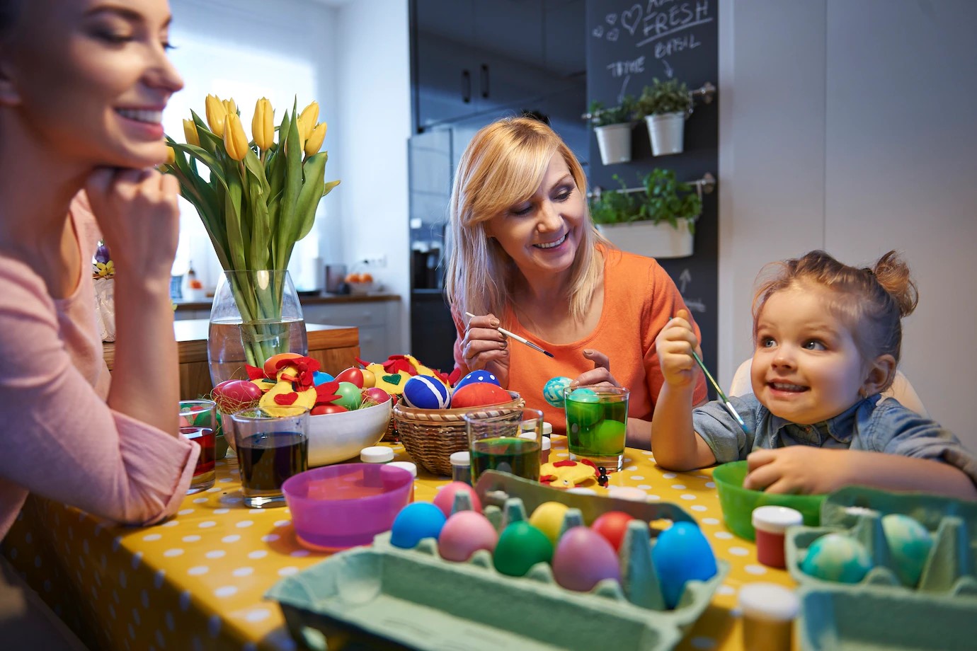 family decorating Easter eggs as an activity 
